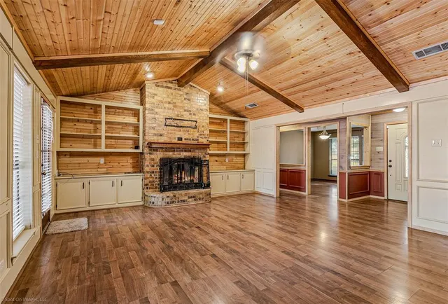 a view of a livingroom with wooden floor