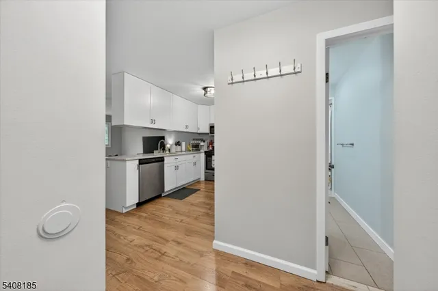a view of kitchen with cabinets and wooden floor