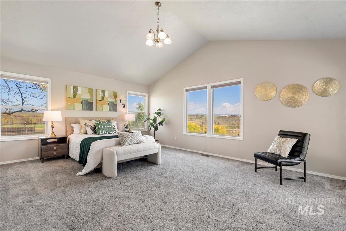 147 East Indian Crk Road Boise, ID 83716 - Photo 14 of 43 Spacious room featuring vaulted ceilings, light gray carpeting, and multiple large windows