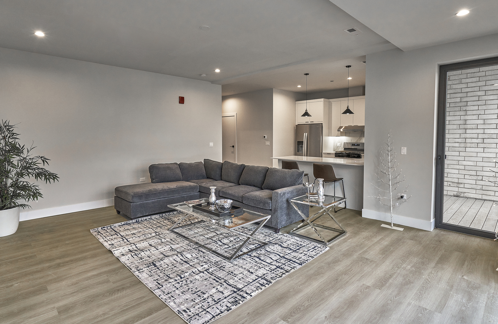 503 East Pershing Road, Unit 403 Chicago, IL 60653 - Photo 13 of 29 a living room with furniture and wooden floor