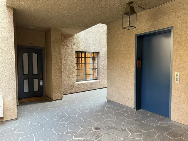 a view of parking garage with cars