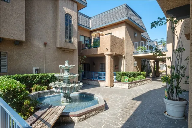 a view of a backyard with sitting area and furniture