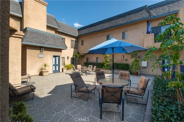 a kitchen with a sink a stove and cabinets