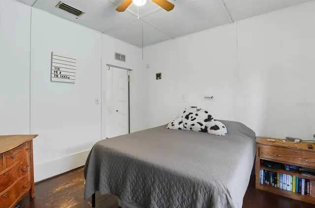 a bedroom with a bed and a dresser