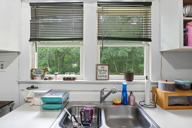 a room with furniture and a large window