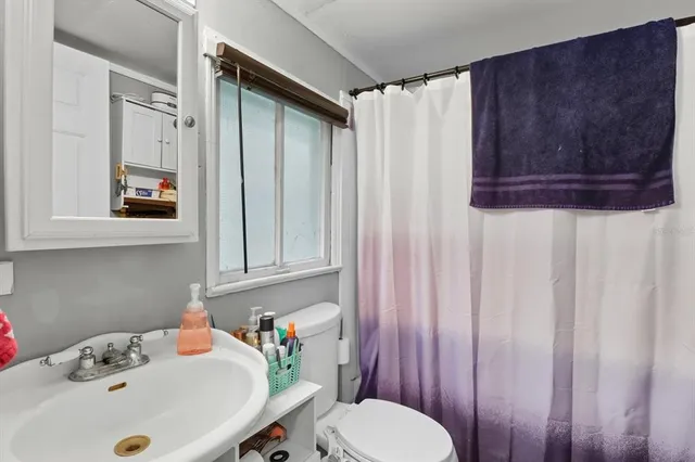 a bathroom with a sink and a toilet