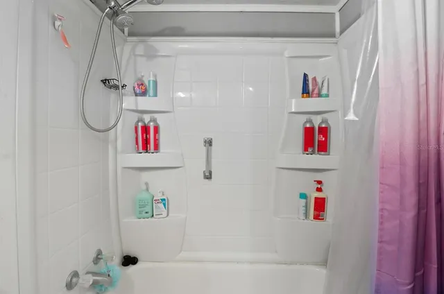 a bedroom with furniture and a wooden floor