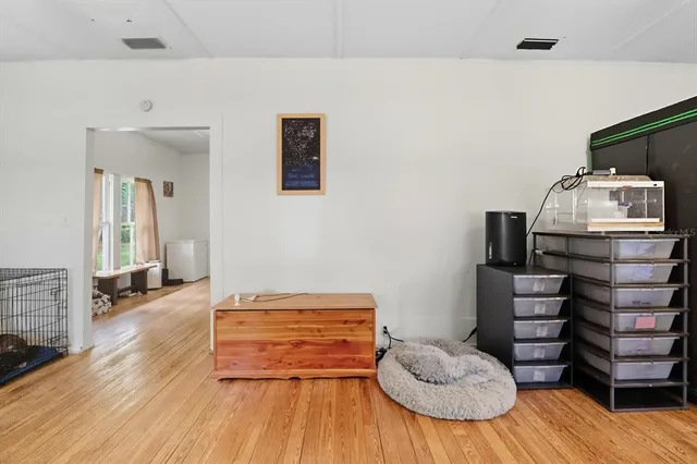 a room with furniture and a wooden floor