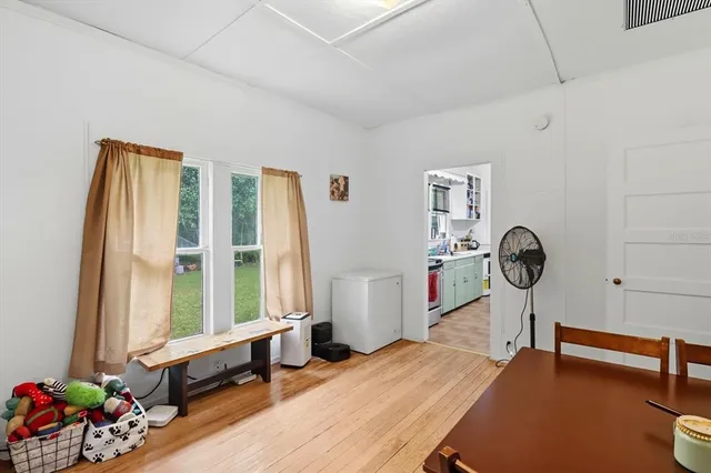 a bedroom with furniture and a window