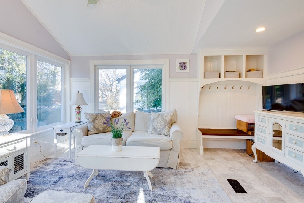 227 Warren Street Needham, MA 02492 - Photo 13 of 36 a living room with furniture and a flat screen tv