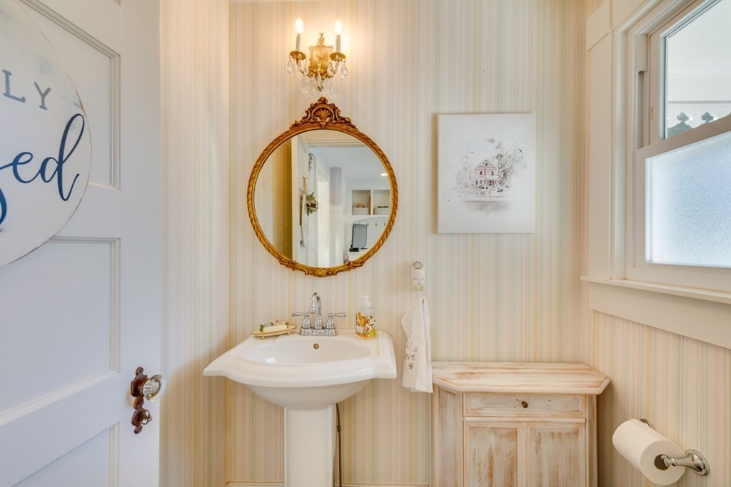 227 Warren Street Needham, MA 02492 - Photo 15 of 36 a bathroom with a sink and a mirror