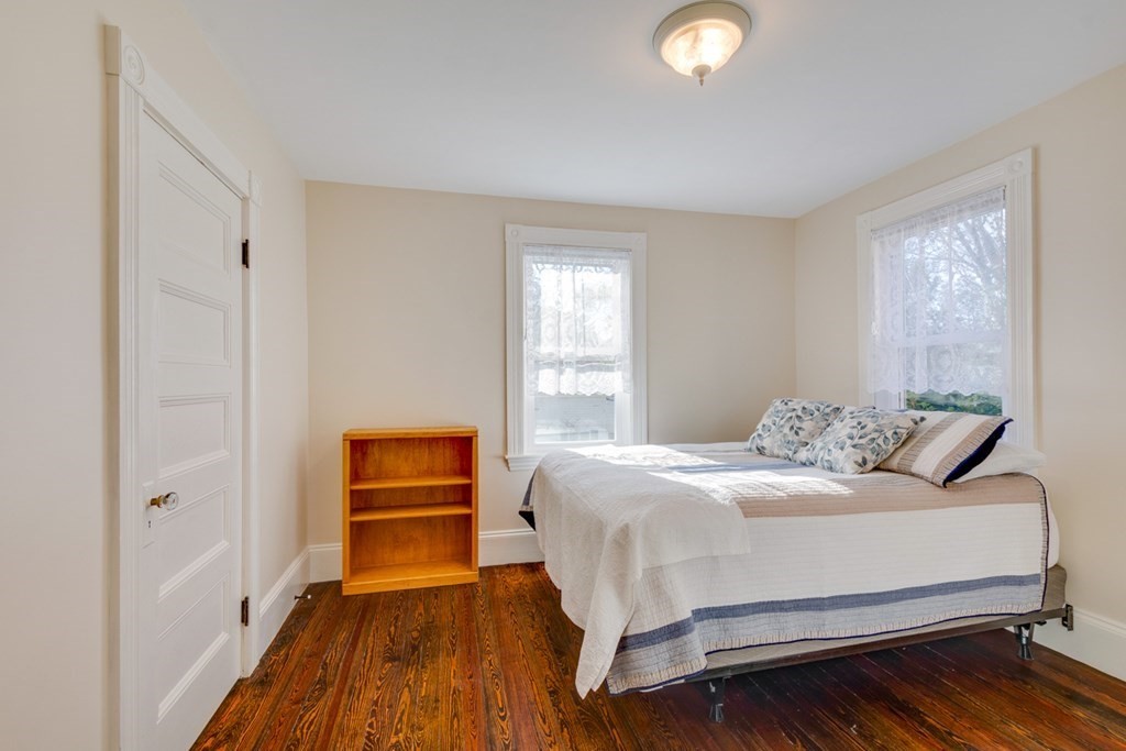 227 Warren Street Needham, MA 02492 - Photo 19 of 36 a bedroom with a bed and a window