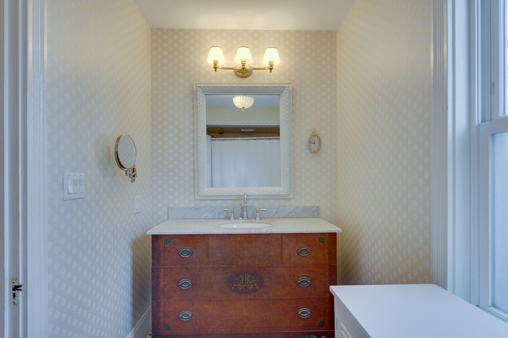 227 Warren Street Needham, MA 02492 - Photo 20 of 36 a bathroom with a sink and a mirror