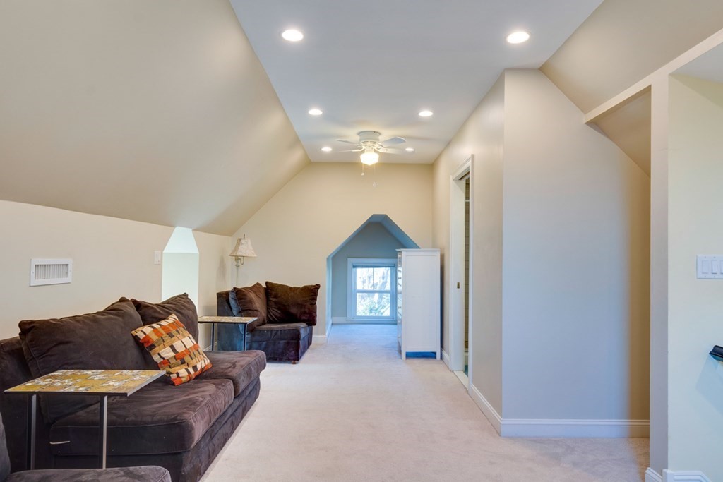 227 Warren Street Needham, MA 02492 - Photo 22 of 36 a living room with furniture and a ceiling fan