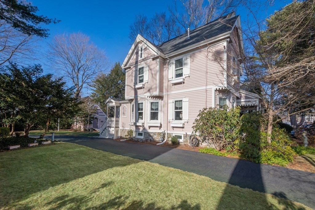 227 Warren Street Needham, MA 02492 - Photo 27 of 36 a view of a white house with a yard