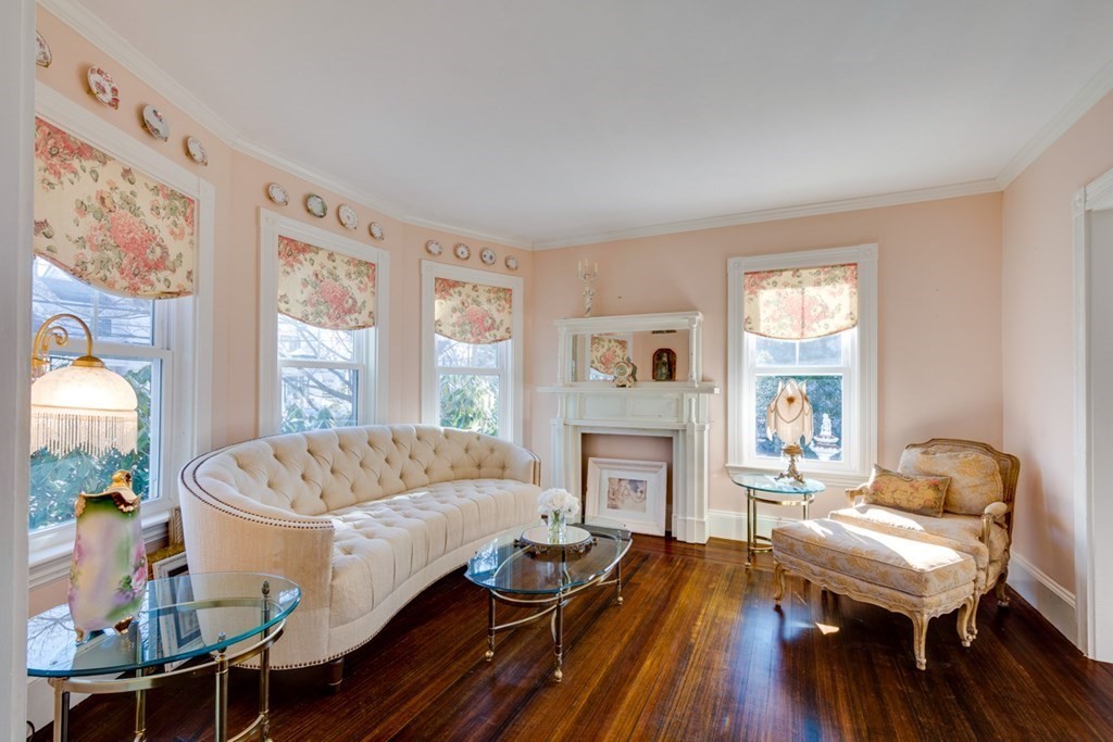 227 Warren Street Needham, MA 02492 - Photo 3 of 36 a living room with a couch and a wooden floor