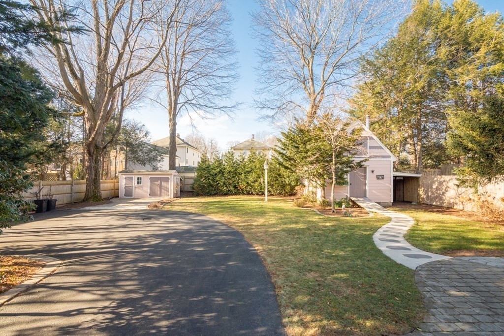 227 Warren Street Needham, MA 02492 - Photo 31 of 36 a view of a yard with plants and trees