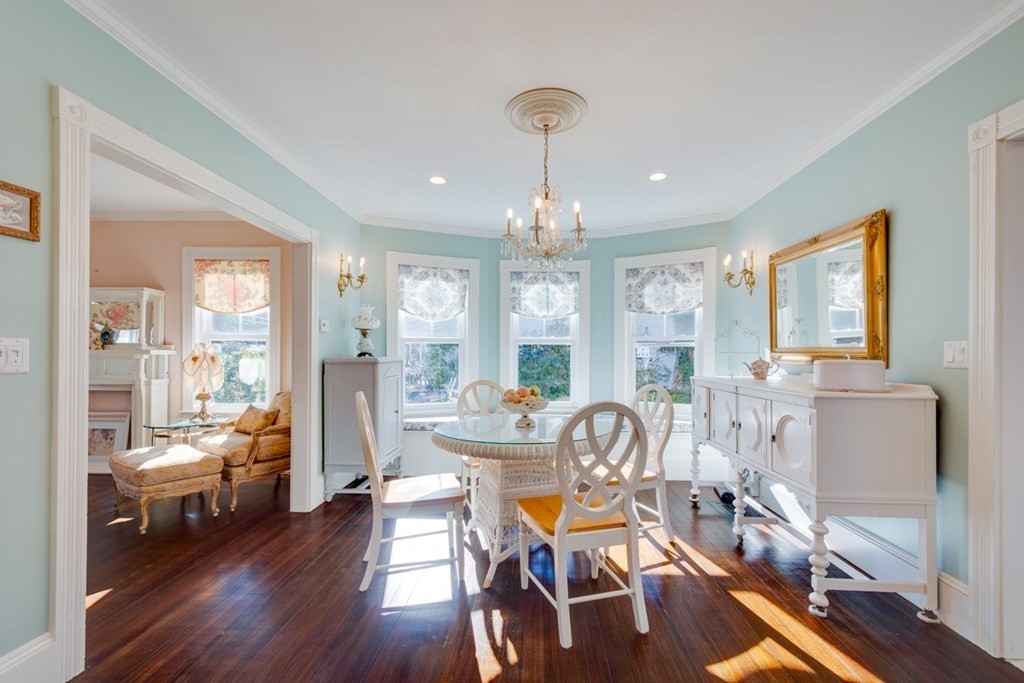 227 Warren Street Needham, MA 02492 - Photo 5 of 36 a view of a dining room with furniture large windows and wooden floor