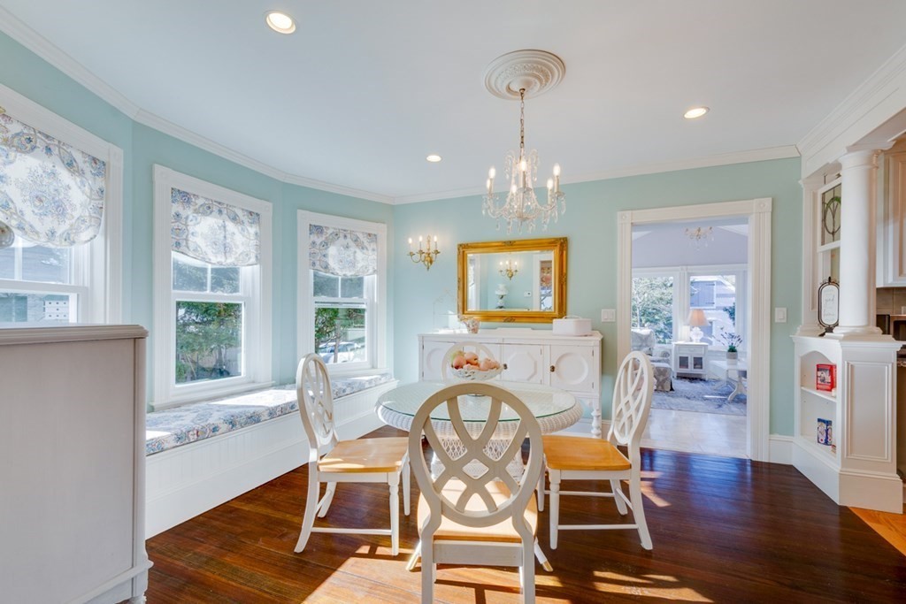 227 Warren Street Needham, MA 02492 - Photo 6 of 36 a living room with furniture a flat screen tv and wooden floor