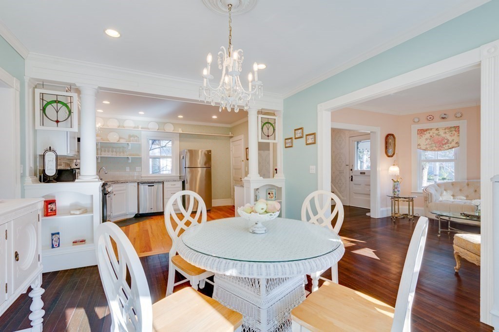 227 Warren Street Needham, MA 02492 - Photo 8 of 36 a view of a dining room with furniture wooden floor and chandelier