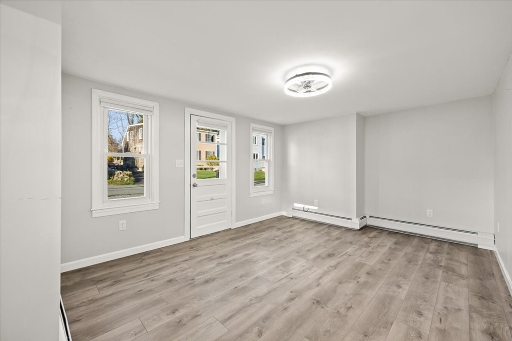 24 Harvard Street Fairhaven, MA 02719 - Photo 14 of 31 a view of an empty room with window and wooden floor