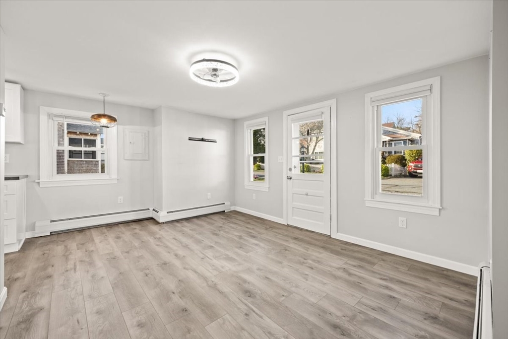 24 Harvard Street Fairhaven, MA 02719 - Photo 15 of 31 a view of an empty room with window and wooden floor