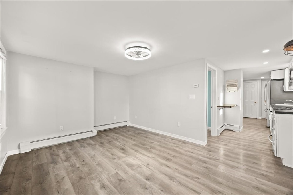 24 Harvard Street Fairhaven, MA 02719 - Photo 17 of 31 a view of empty room with wooden floor