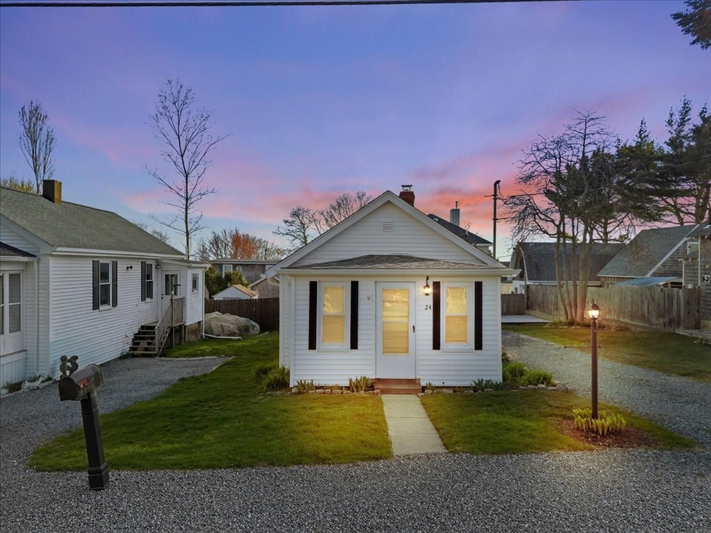 24 Harvard Street Fairhaven, MA 02719 - Photo 2 of 31 a front view of a house with a yard