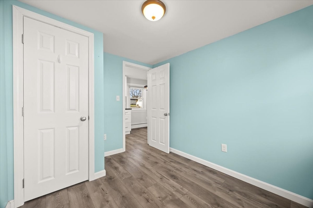 24 Harvard Street Fairhaven, MA 02719 - Photo 22 of 31 wooden floor in an empty room