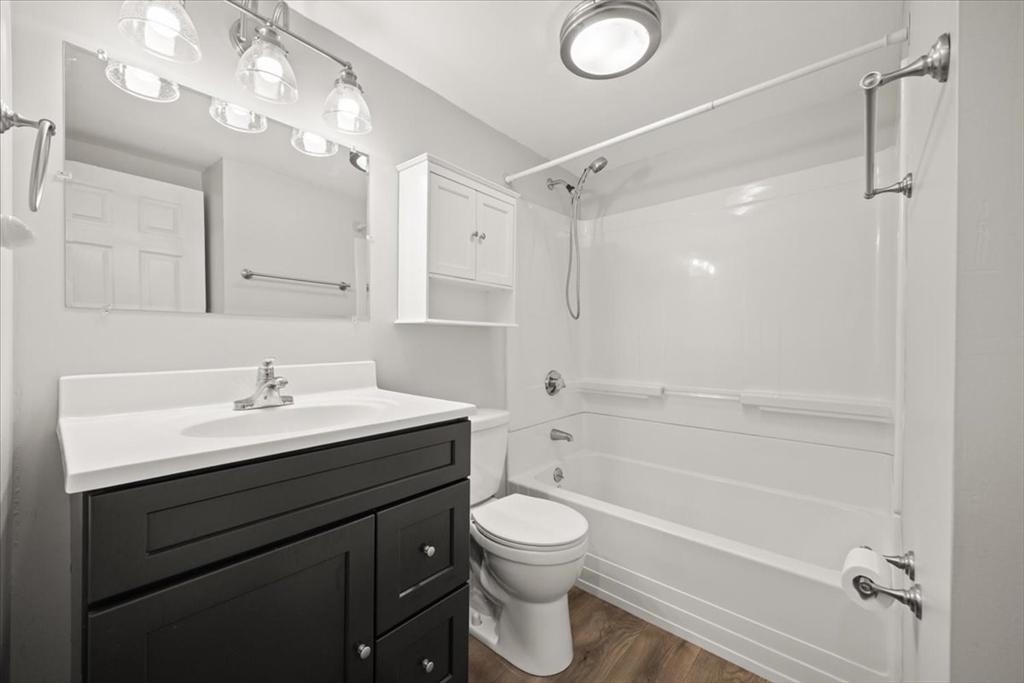 24 Harvard Street Fairhaven, MA 02719 - Photo 23 of 31 a bathroom with a sink a toilet and shower