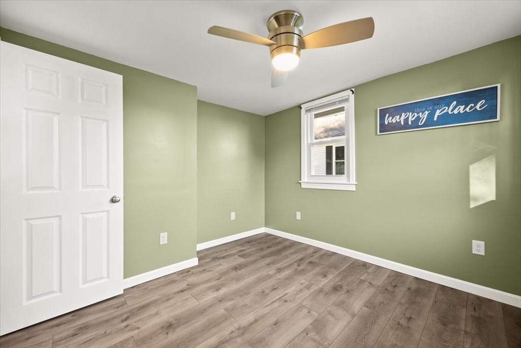 24 Harvard Street Fairhaven, MA 02719 - Photo 25 of 31 an empty room with wooden floor and windows