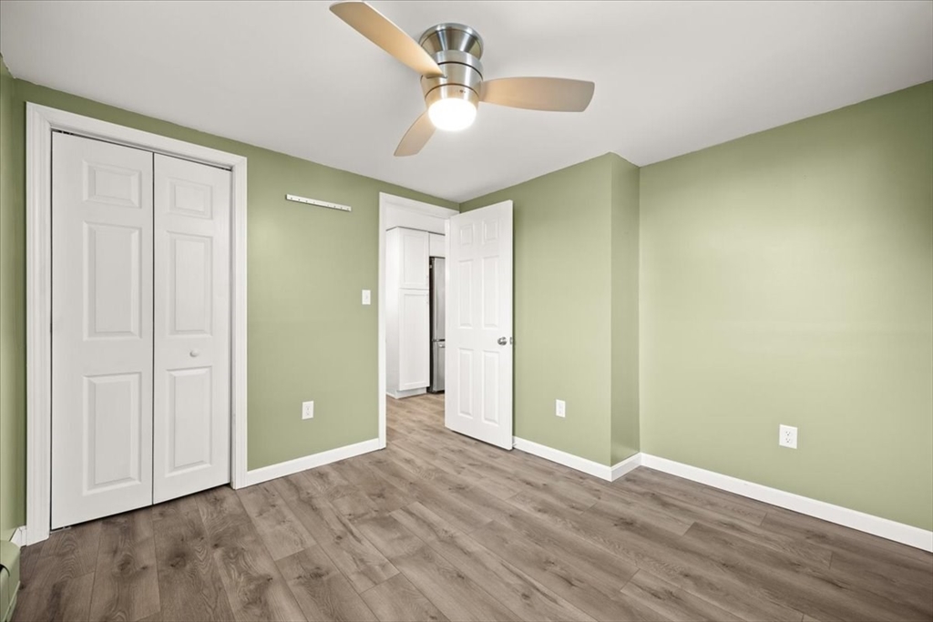 24 Harvard Street Fairhaven, MA 02719 - Photo 26 of 31 an empty room with closet and a ceiling fan