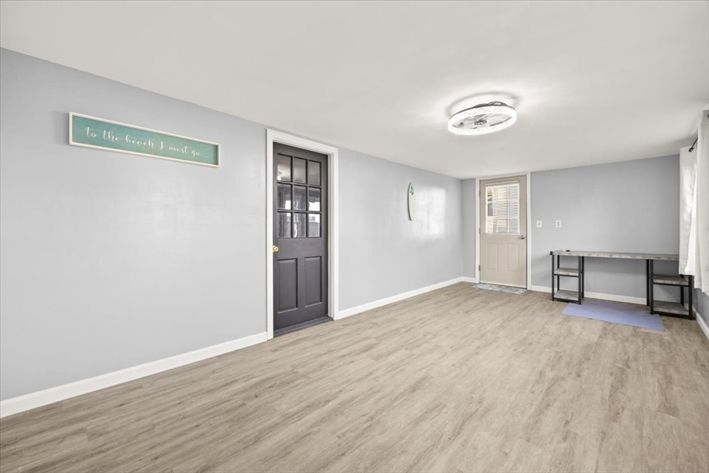 24 Harvard Street Fairhaven, MA 02719 - Photo 28 of 31 a view of an empty room with wooden floor