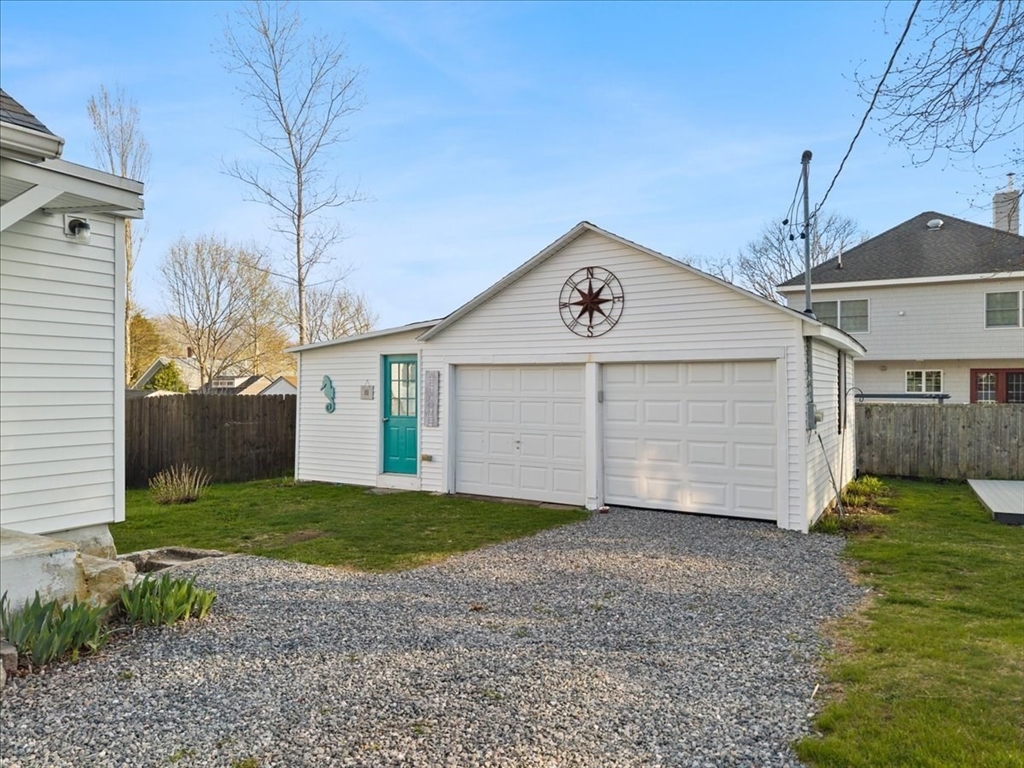 24 Harvard Street Fairhaven, MA 02719 - Photo 4 of 31 a view of a house with a yard and garage