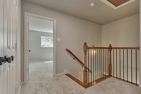 a view of a hallway with windows