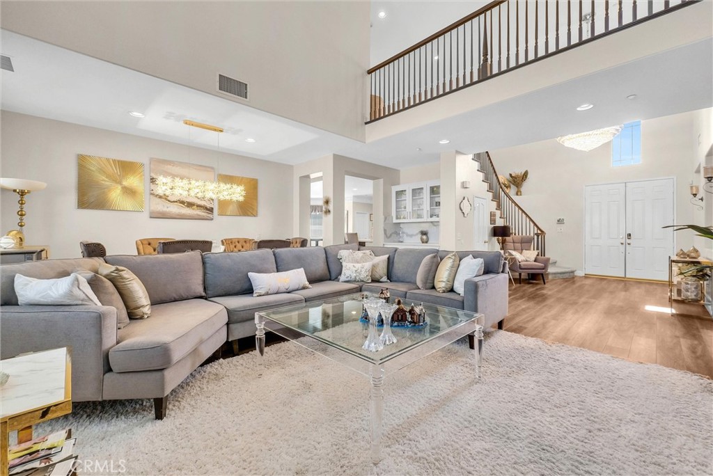 11499 Bridgeway Drive Riverside, CA 92505 - Photo 9 of 70 a living room with furniture and stairs