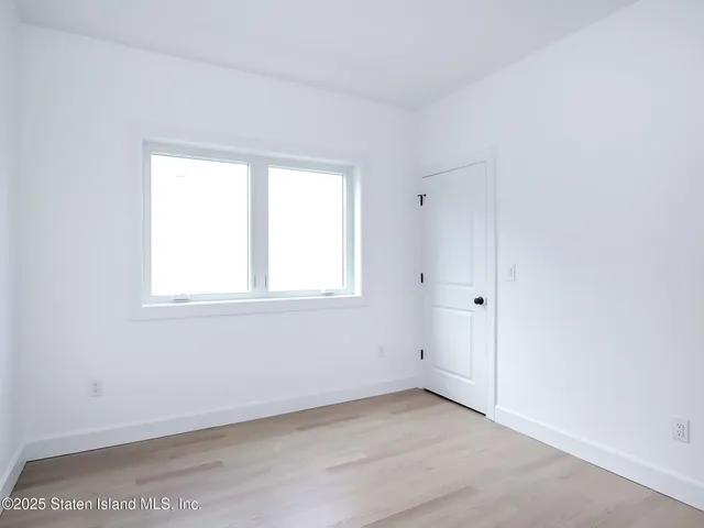 a picture of a bathroom with a rug