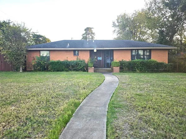 a front view of a house with yard