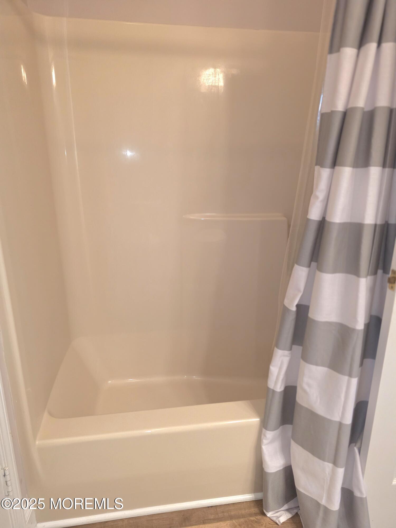 61 Sandpiper Road Barnegat, NJ 08005 - Photo 26 of 44 a bathroom with a bathtub and a shower