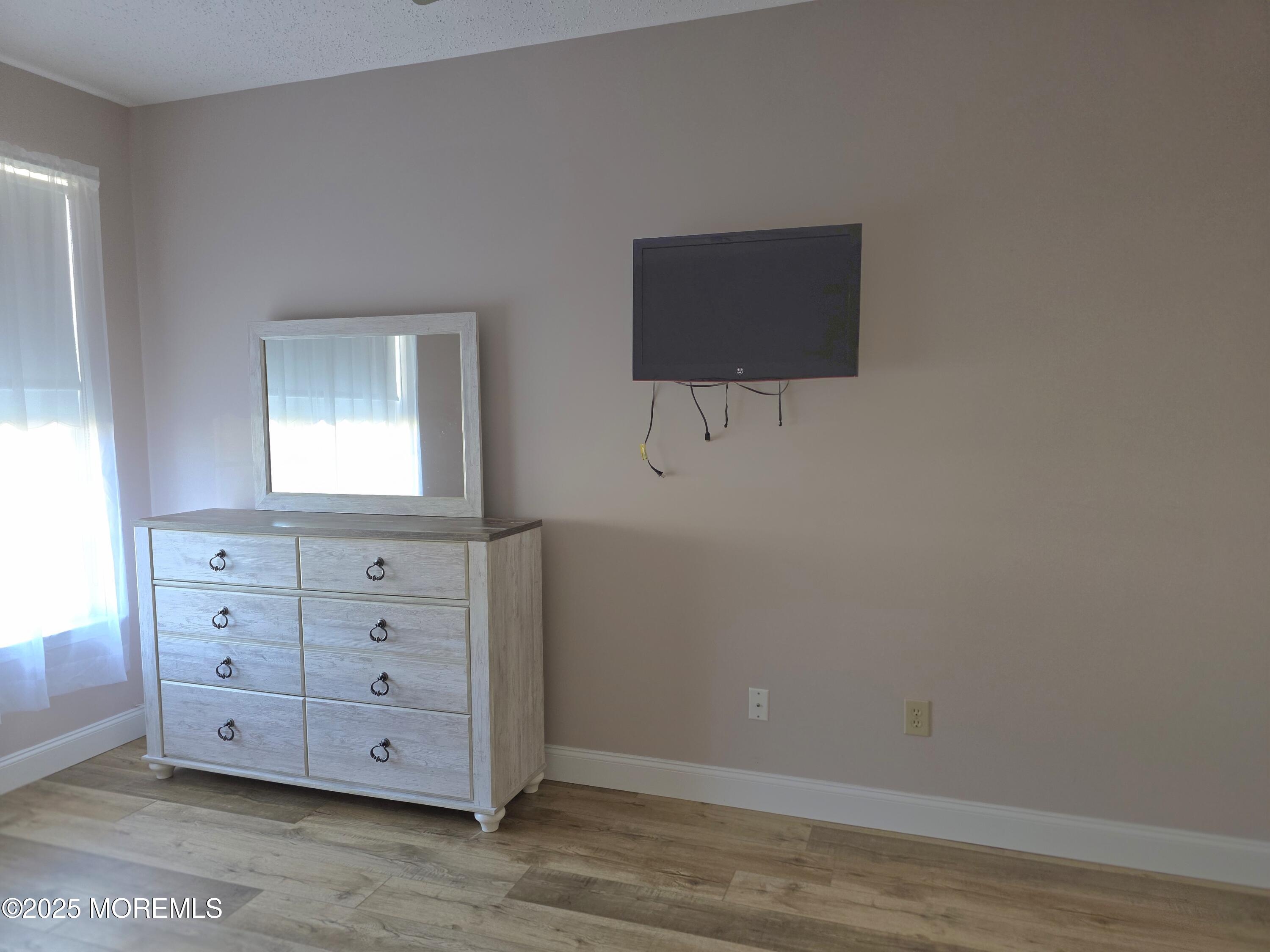 61 Sandpiper Road Barnegat, NJ 08005 - Photo 37 of 44 a view of a dresser with wooden floor