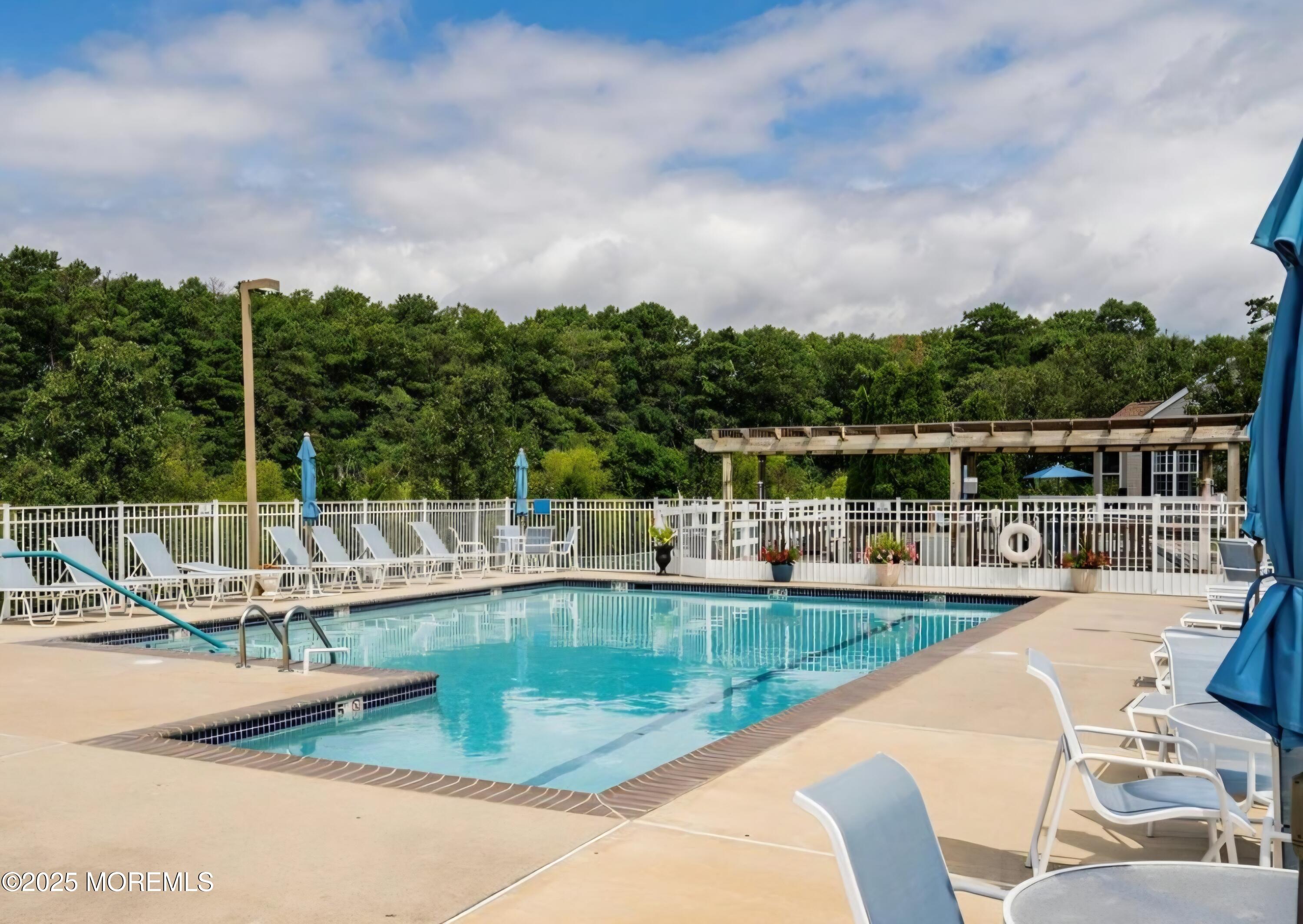61 Sandpiper Road Barnegat, NJ 08005 - Photo 4 of 44 a view of a lake with a house in the background