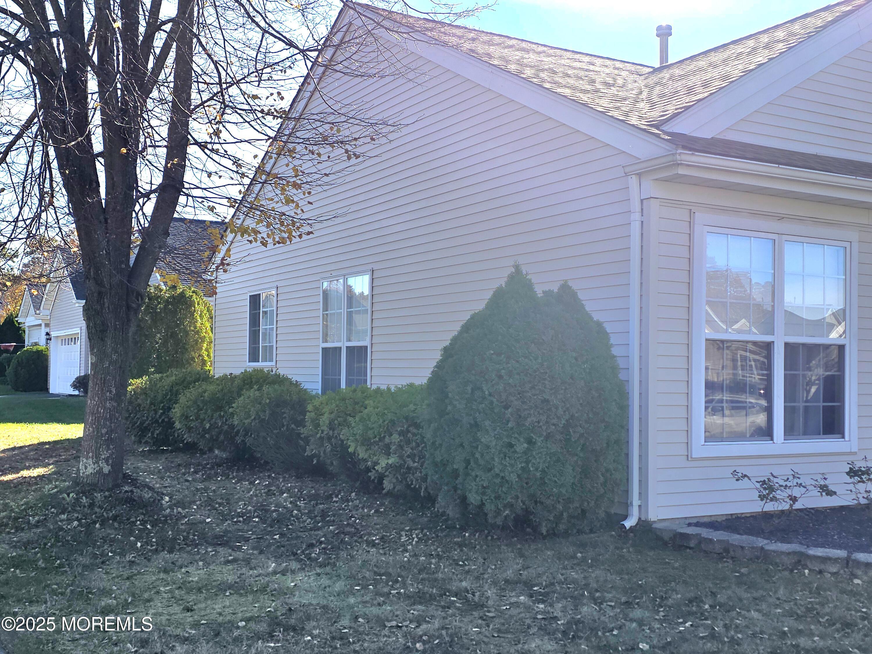 61 Sandpiper Road Barnegat, NJ 08005 - Photo 44 of 44 a view of a house with a yard and large tree