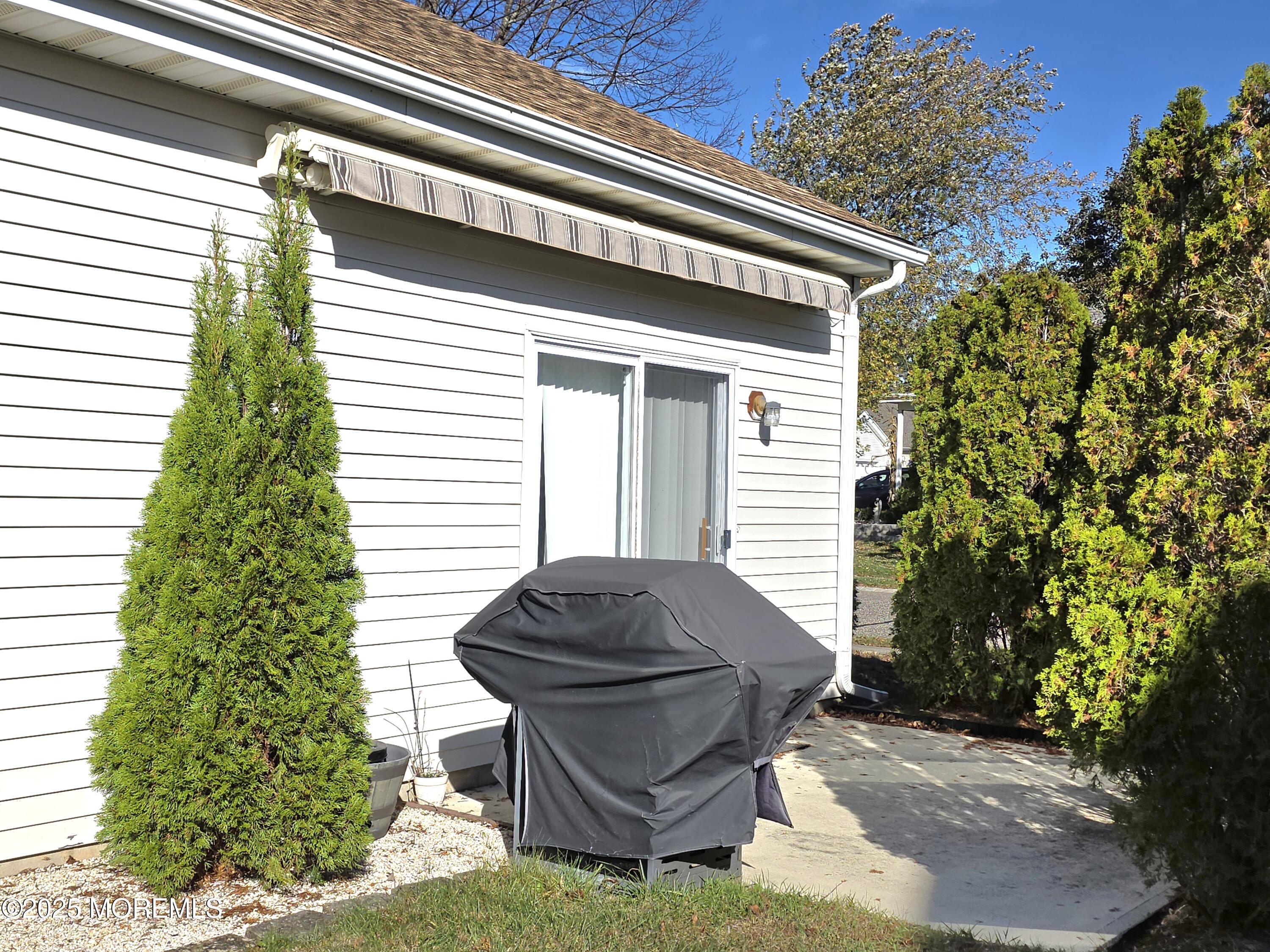 61 Sandpiper Road Barnegat, NJ 08005 - Photo 7 of 44 a view of backyard with outdoor seating and plants