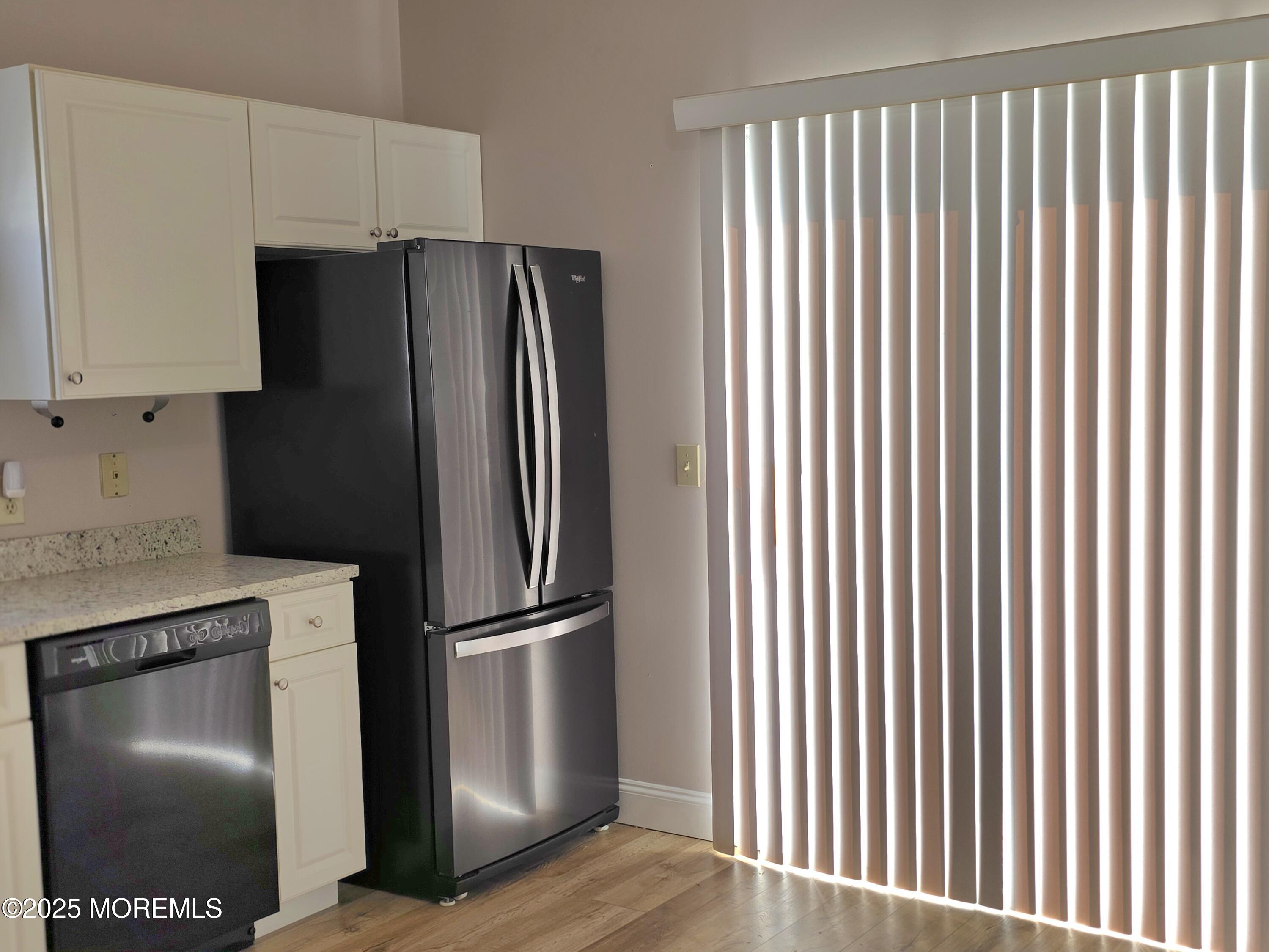 61 Sandpiper Road Barnegat, NJ 08005 - Photo 10 of 44 a metallic refrigerator freezer sitting in a kitchen