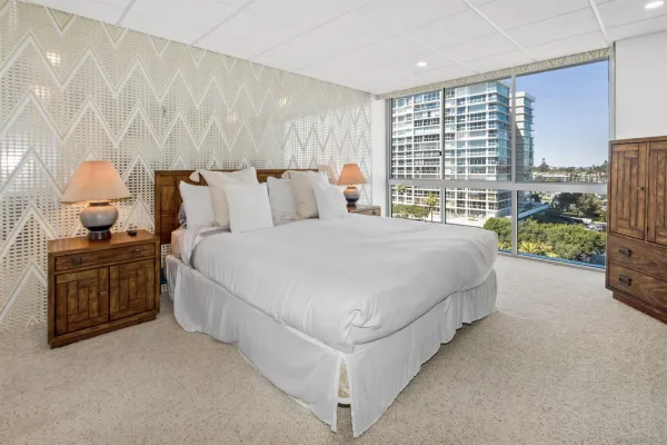 a spacious bedroom with a bed and window