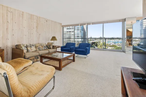 a living room with furniture and a large window
