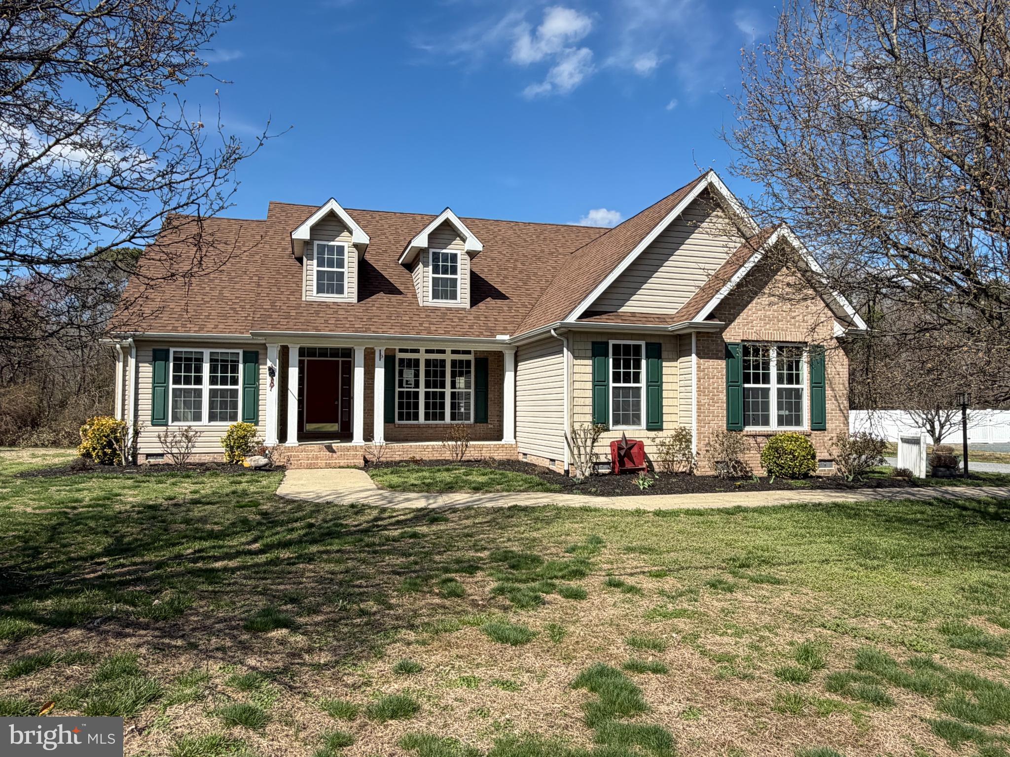 8617 Portsville Road Laurel, DE 19956 - Photo 1 of 47 a front view of a house with a yard