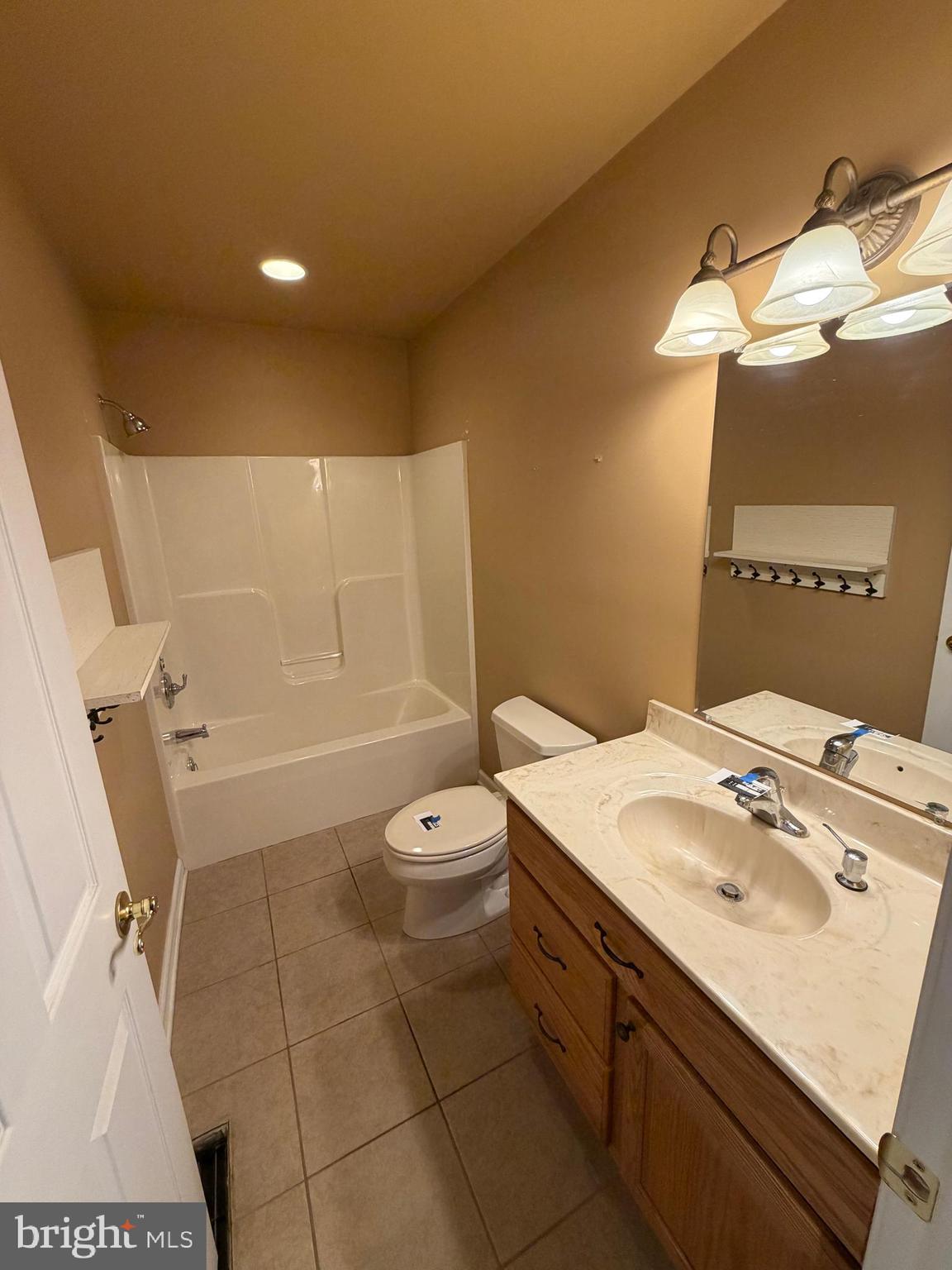 8617 Portsville Road Laurel, DE 19956 - Photo 39 of 47 a bathroom with a sink a toilet and shower