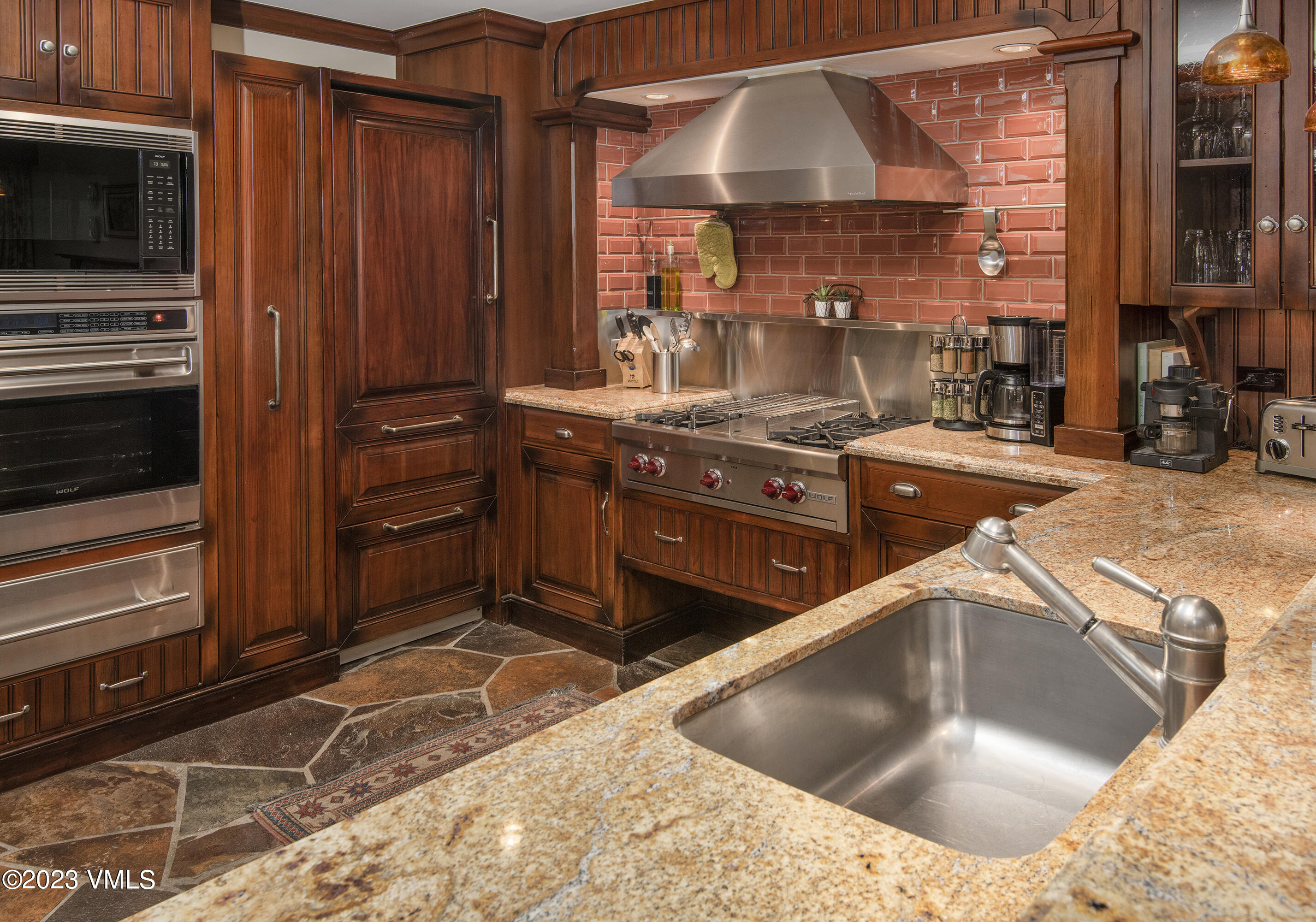 1 Willow Bridge Road, Unit 31A Vail, CO 81657 - Photo 10 of 49 a kitchen with stainless steel appliances granite countertop a sink and a stove