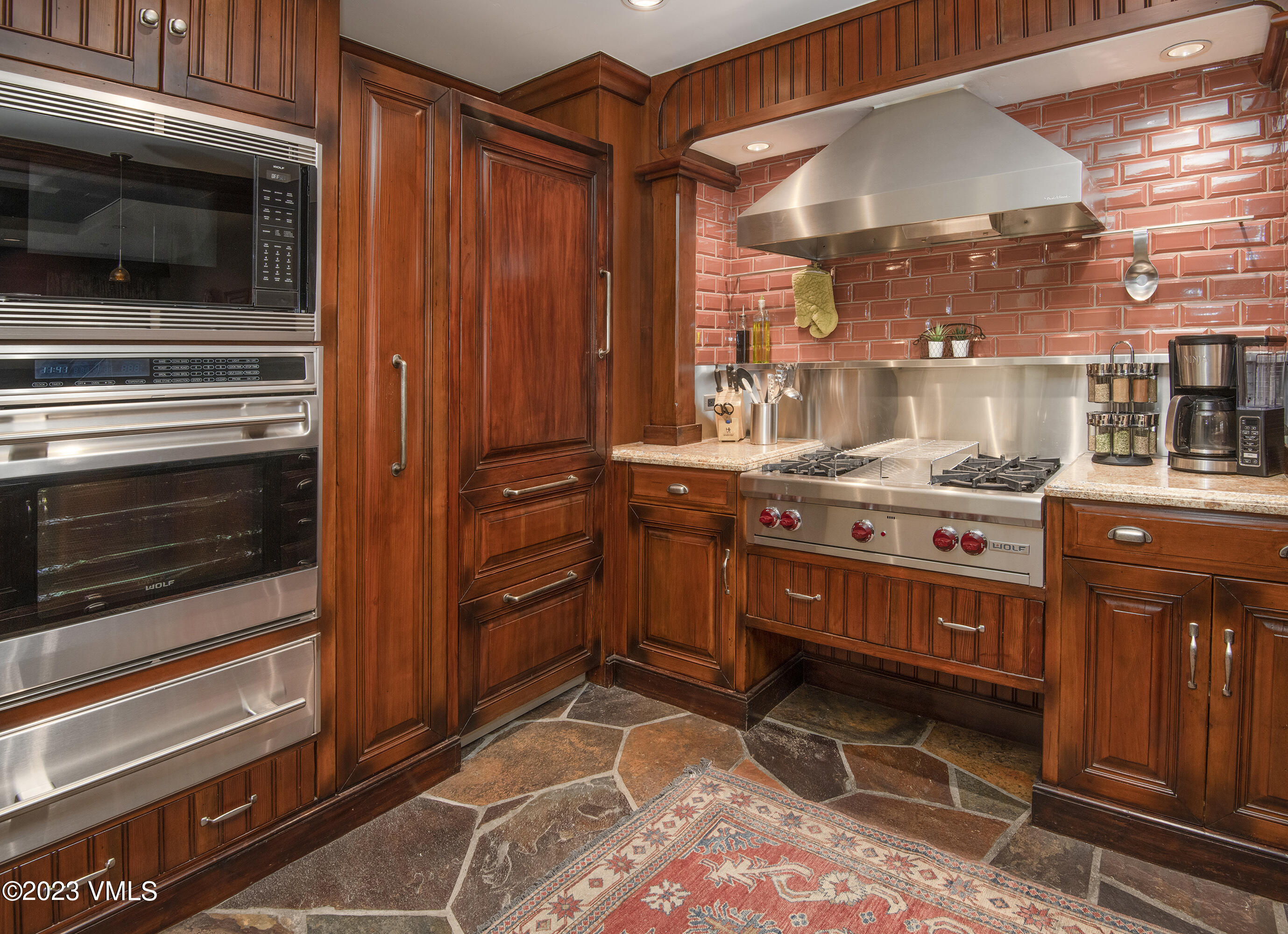 1 Willow Bridge Road, Unit 31A Vail, CO 81657 - Photo 11 of 49 a kitchen with stainless steel appliances a stove and a microwave